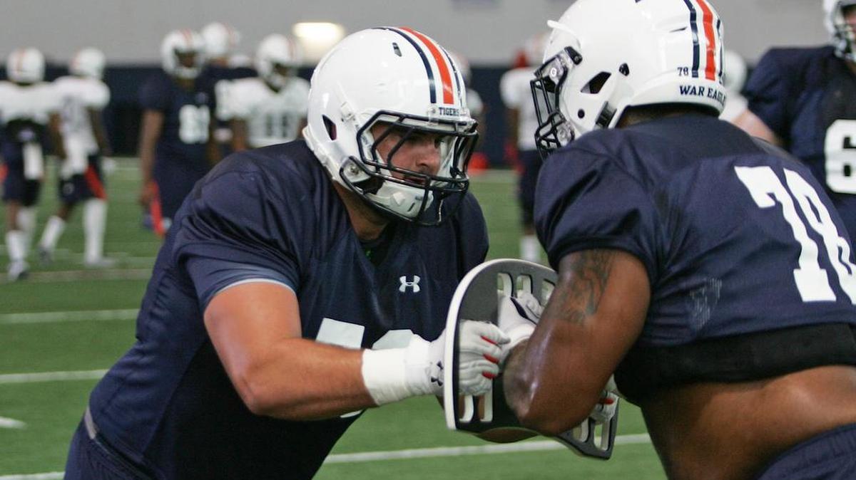 Auburn offensive line Austin Golson runs drills at practice on Friday, Aug. 5, 2016 at the university's athletic complex.