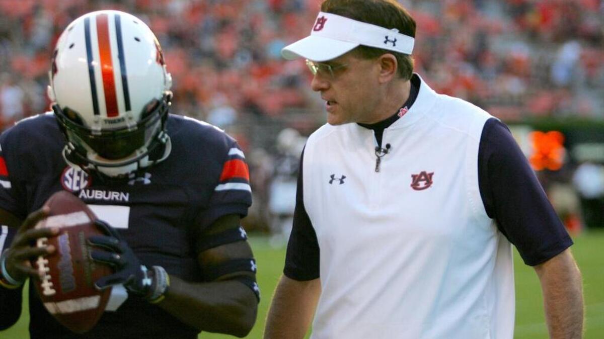 Auburn coach Gus Malzahn talks to quarterback John Franklin III before the team’s game against Arkansas St. Saturday, Sept. 10, 2016 at Jordan-Hare Stadium.