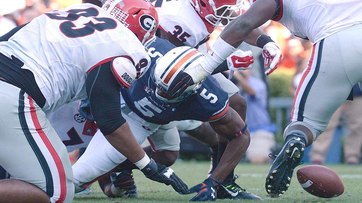 Auburn wide receiver Ricardo Louis (5) fumbles the ball near the end zone during second half of an NCAA college football game against Georgia, Saturday, Nov. 14, 2015, in Auburn, Ala. (Julie Bennett | AP Photo)