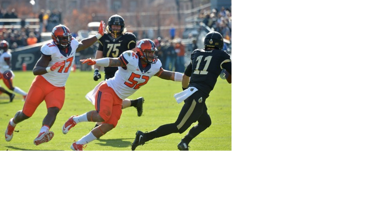 TJ Neal pressures Purdue’s quarterback in a 48-14 win. (Mark Jones | Illinois Athletics)