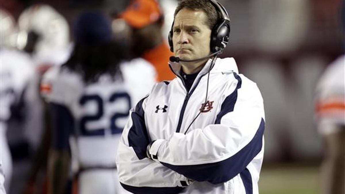 Auburn coach Gene Chizik watches from the sidelines during the second half of an NCAA college football game against Alabama in 2012.