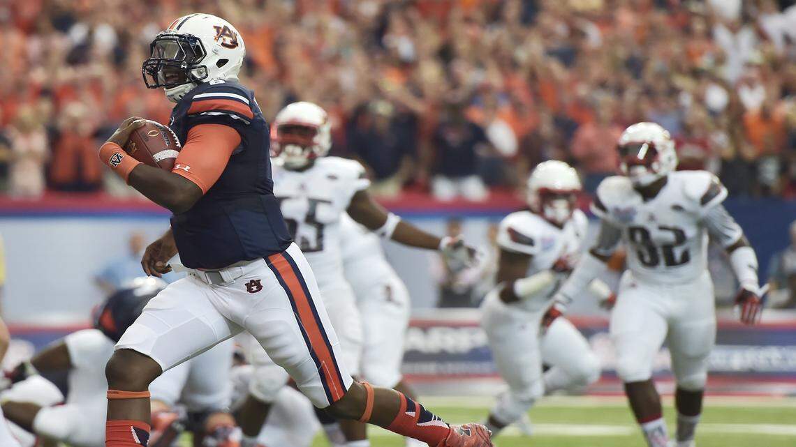Auburn quarterback Jeremy Johnson (6) runs into the end zone for a touchdown against Louisville during the first half of an NCAA college football game, Saturday, Sept. 5, 2015, in Atlanta. (AP Photo/Mike Stewart)