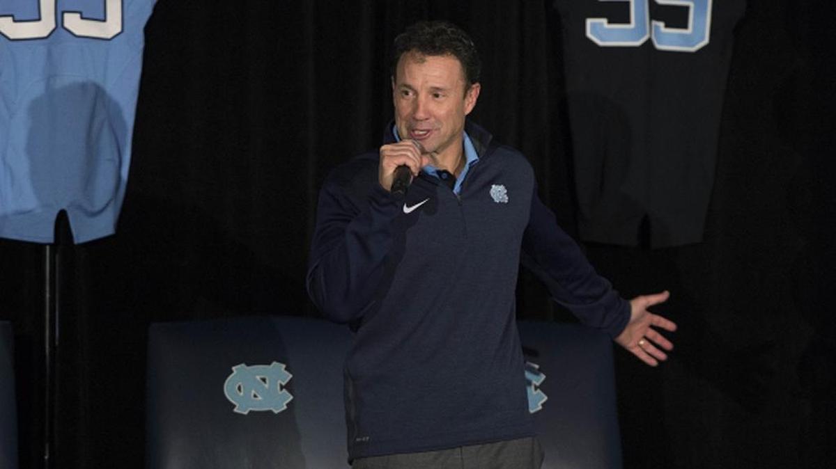 University of North Carolina coach Larry Fedora speaks to fans at a national signing day event.