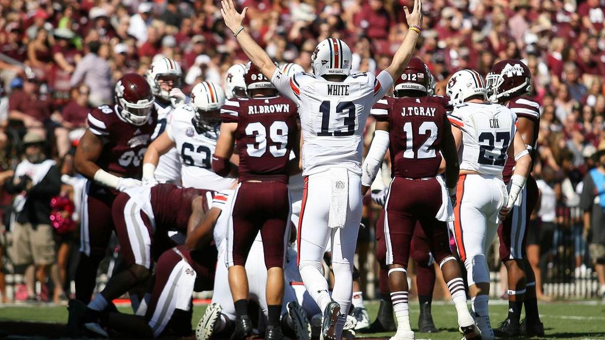 Auburn quarterback Sean White, No. 13, celebrates his team's touchdown against Mississippi State at Davis Wade Stadium in Starkville, Miss., Saturday, Oct. 8, 2016.