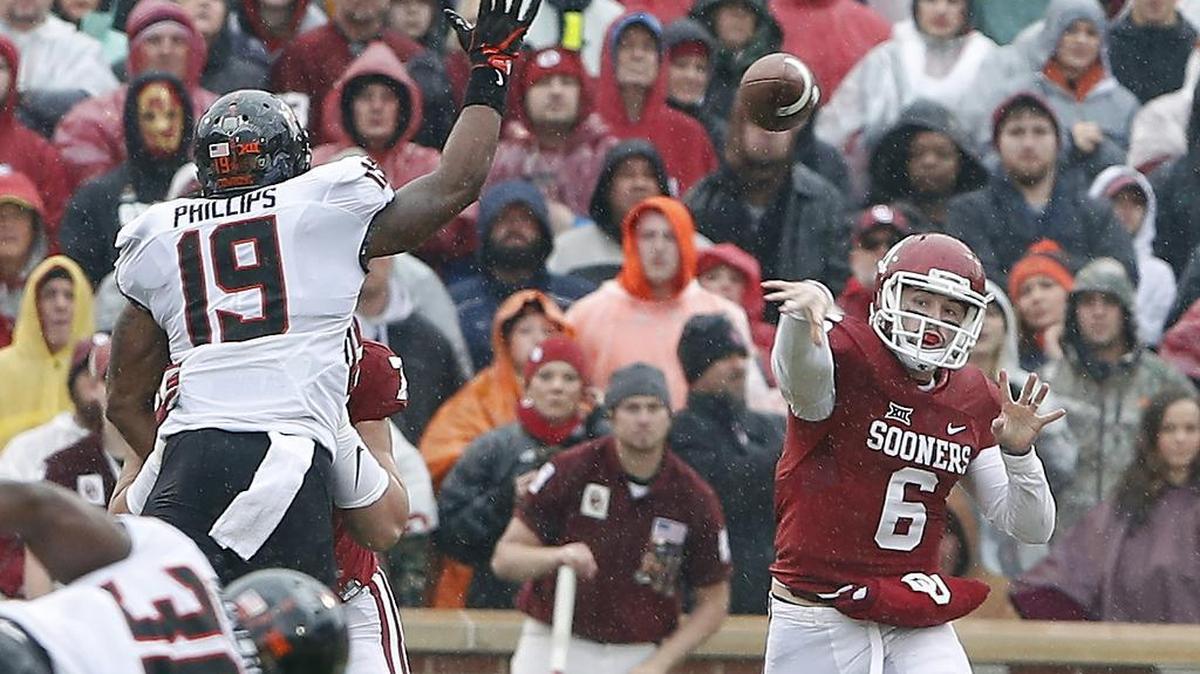 Oklahoma quarterback Baker Mayfield (6) passes against Oklahoma State Saturday, Dec. 3, 2016, in Norman, Okla.
