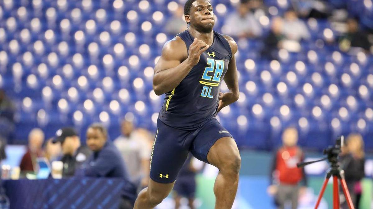 Auburn defensive end Carl Lawson competes in the 40-yard dash at the 2017 NFL football scouting combine Sunday, March 5, 2017, in Indianapolis.