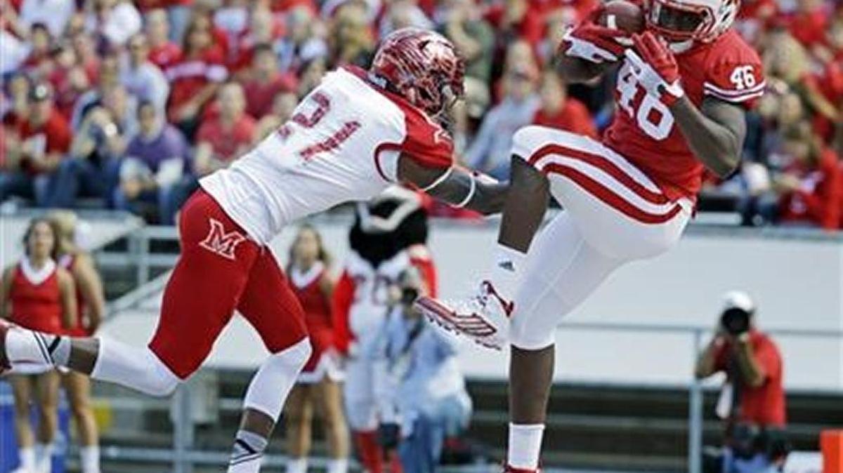 Wisconsin's Austin Traylor catches a touchdowns in front of Miami of Ohio's Marshall Taylor, No. 21, on Saturday, Sept. 12, 2015.