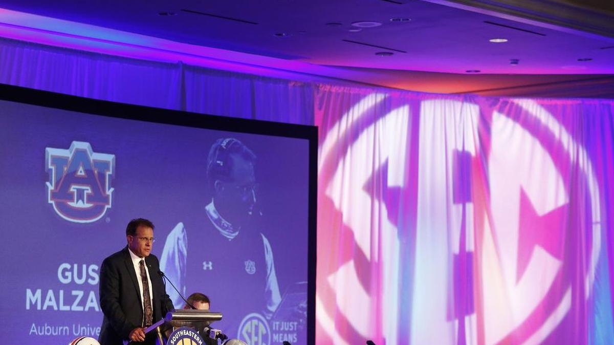 Auburn coach Gus Malzahn speaks to the media at the SEC media days.