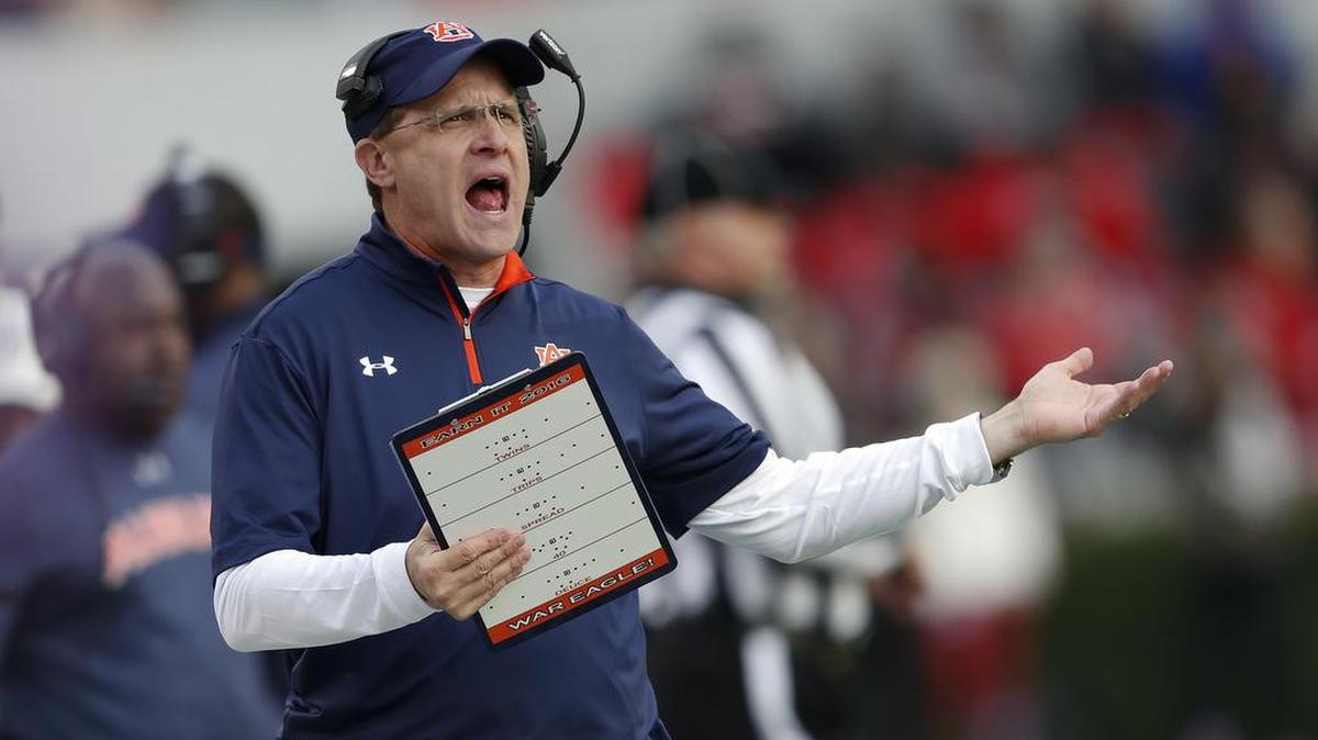 Auburn head coach Gus Malzahn yells at an official during the first half of an NCAA college football game against Georgia Saturday, Nov. 12, 2016, in Athens, Ga.