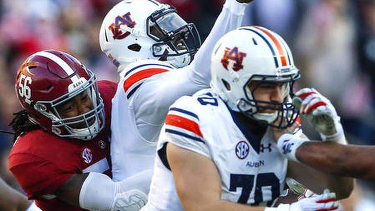 Alabama linebacker Tim Williams (56) hits Auburn quarterback Jeremy Johnson (6) causing an incomplete pass during the first half of the Iron Bowl NCAA college football game, Saturday, Nov. 26, 2016, in Tuscaloosa, Ala.