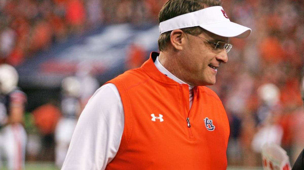 Auburn coach Gus Malzahn talks with players before facing Clemson Saturday, Sept. 3, 2016 at Jordan-Hare Stadium.