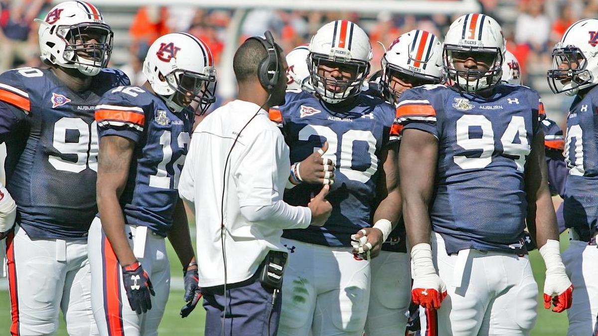 Auburn linebackers coach Travis Williams addresses the defense on A-Day at Jordan-Hare Stadium Saturday, April 9, 2016.