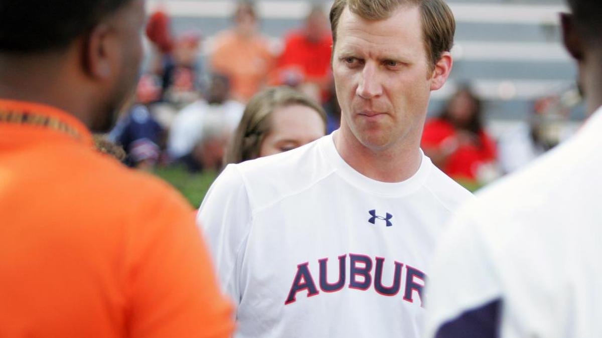 Auburn offensive coordinator Rhett Lashlee speaks with recruits before the team's game against Arkansas St.