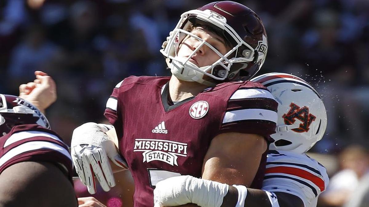 Mississippi State quarterback Nick Fitzgerald (7) fumbles the ball after being hit by a Auburn defender in the first half of an NCAA college football game Saturday, Oct. 8, 2016, in Starkville, Miss.