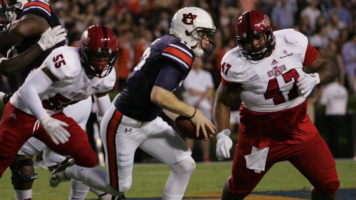 Auburn quarterback Sean White tries to avoid Arkansas St. defenders Saturday, Sept. 10, 2016 at Jordan-Hare Stadium.