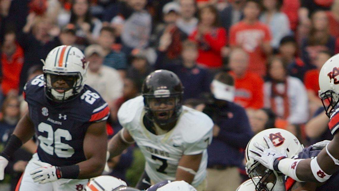 The Auburn defense gangs up to tackle Idaho running back Isaiah Sanders in the first half Saturday, Nov. 21, 2015 at Jordan-Hare Stadium. (Michael Niziolek | Ledger-Enquirer.com)