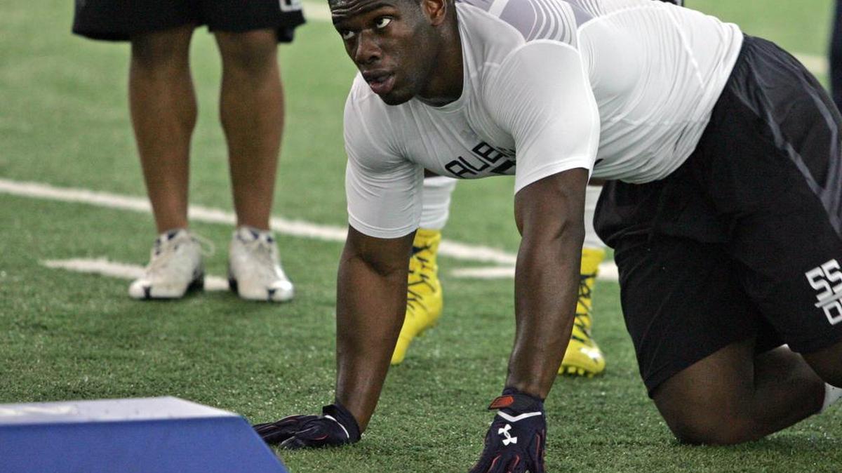 Former Auburn defensive lineman Carl Lawson participates in the program's pro day Friday, March 10, 2017.