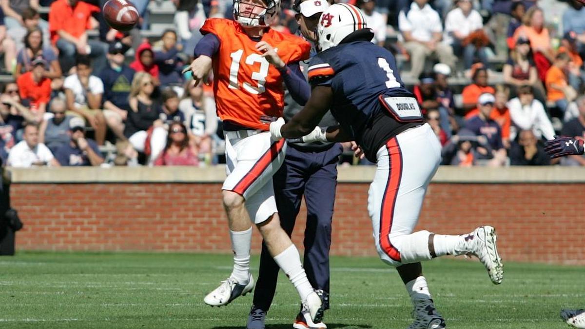 Auburn defensive lineman Montravius Adams, No. 1, pressures quarterback Sean White on A-Day at Jordan-Hare Stadium Saturday, April 9, 2016.