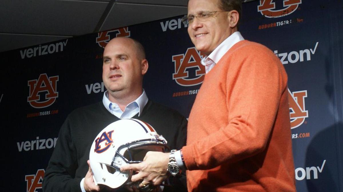 New Auburn offensive coordinator Chip Lindsey, left, poses for a photo with coach Gus Malzahn Saturday, Jan. 21, 2017.
