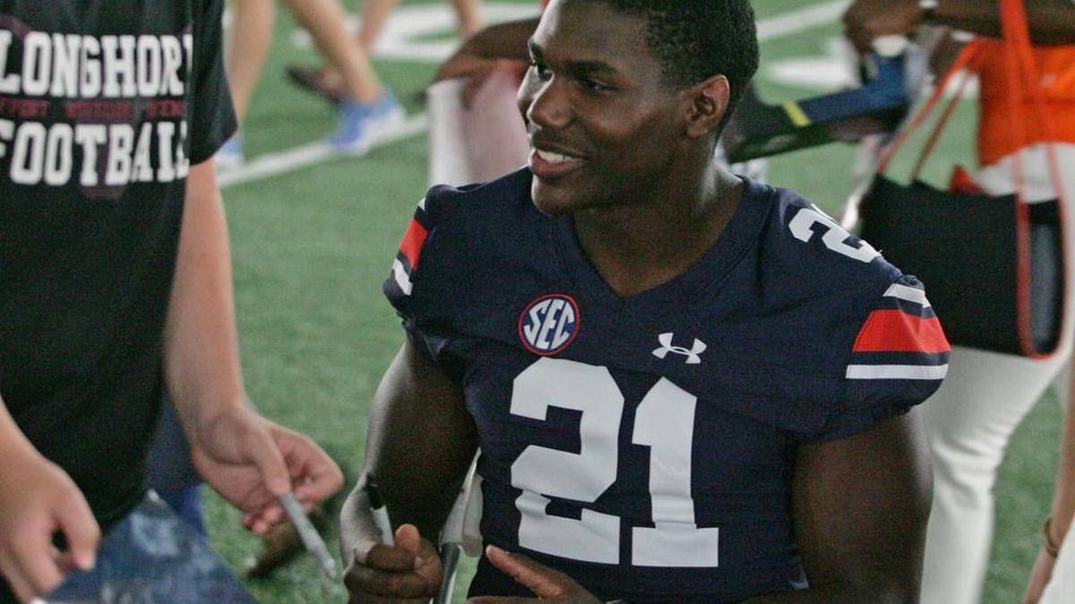 Auburn running back Kerryon Johnson smiles at the program's annual Fan Day.