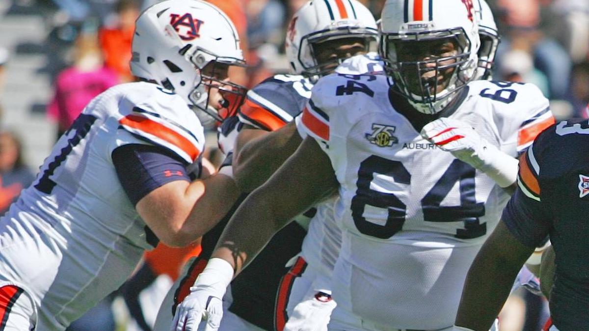 Auburn offensive lineman Mike Horton, No. 64, plays for the white team in the program's annual spring game.