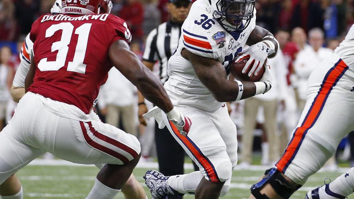 Auburn running back Kamryn Pettway, No. 36, carries against Oklahoma linebacker Ogbonnia Okoronkwo in the Sugar Bowl Monday, Jan. 2, 2017 at the Superdome.