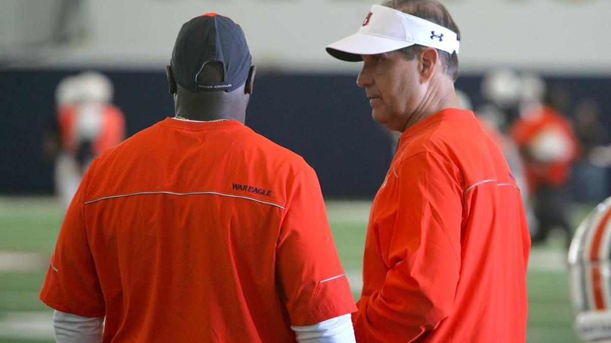 Auburn defensive coordinator Kevin Steele, right, talks with secondary coach Wes McGriff during spring practice on April 5, 2016.