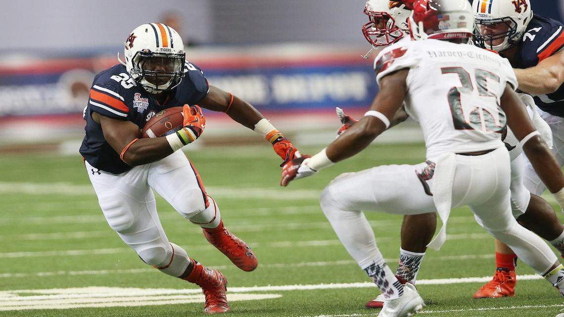 Auburn running back Peyton Barber (25) runs against Louisville during the first half of an NCAA college football game, Saturday, Sept. 5, 2015, in Atlanta. (AP Photo/John Bazemore)