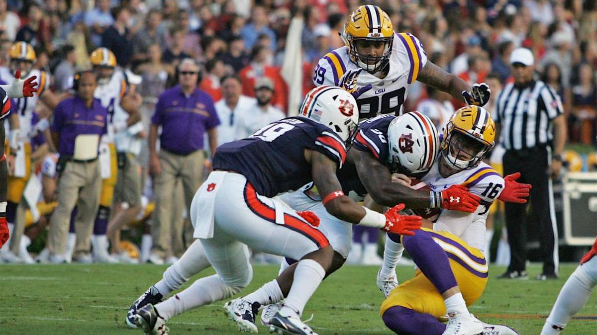 Auburn linebacker Tre Williams, No. 30, hits LSU quarterback Danny Etling with the crown of his helmet Saturday, Sept. 24, 2016 at Jordan-Hare Stadium.