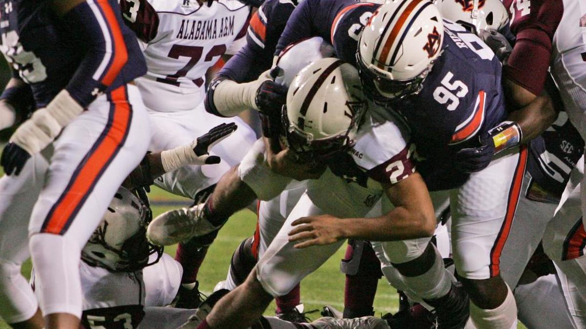 Auburn defensive tackle Dontavius Russell tackles an Alabama A&M's running back Saturday, Nov. 19, 2016 at Jordan-Hare Stadium.