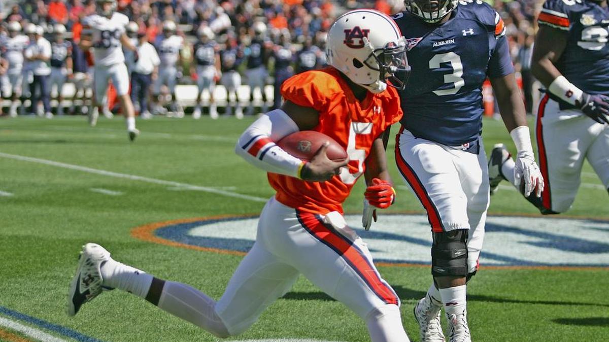 Auburn quarterback John Franklin III, No. 5, runs out of bounds during A-Day at Jordan-Hare Stadium Saturday, April 9, 2016.