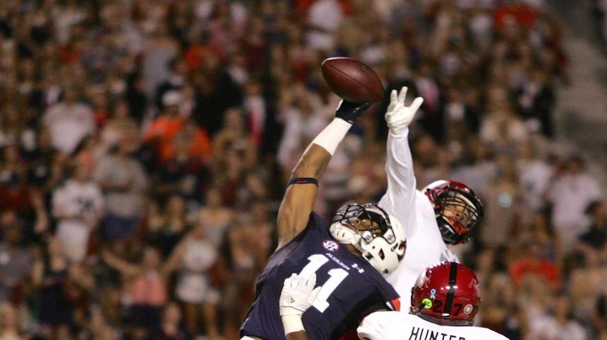 Auburn wide receiver Kyle Davis makes a one-handed catch in double coverage Saturday, Sept. 10, 2016 against Arkansas St. at Jordan-Hare Stadium.