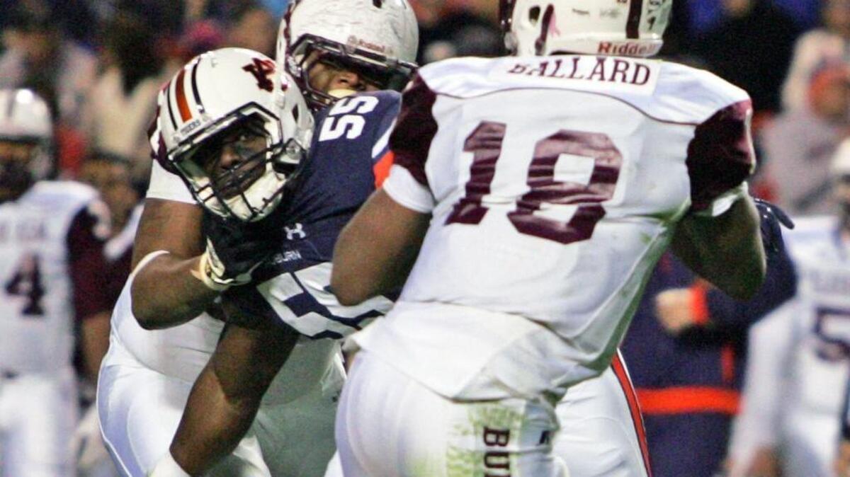 Auburn defensive lineman Carl Lawson was voted to the All-SEC first team by the league's coaches.
