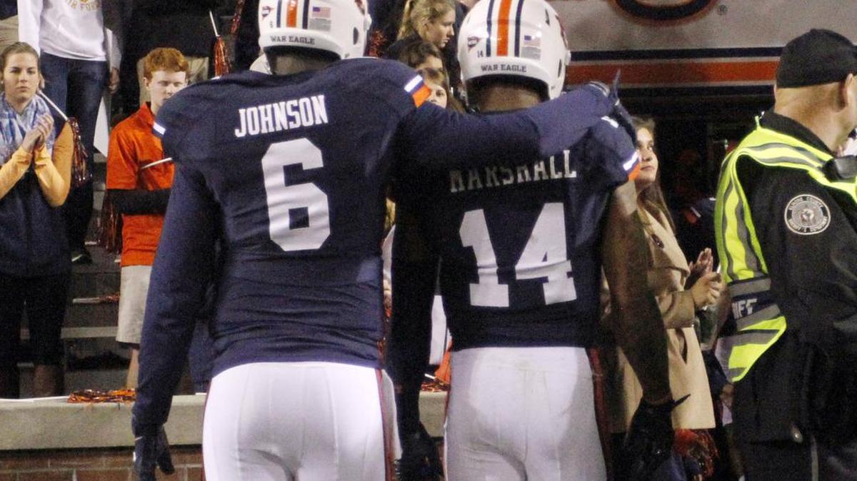 Auburn quarterbacks Jeremy Johnson, left, and Nick Marshall walk off the field after a 41-38 loss to Texas A&M Saturday, Nov. 8, 2014 at Jordan Hare Stadium.