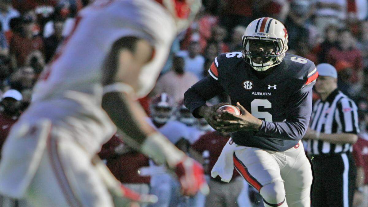 Auburn quarterback Jeremy Johnson runs the ball Saturday, Nov. 28, 2015 against Alabama at Jordan-Hare Stadium in the Iron Bowl.