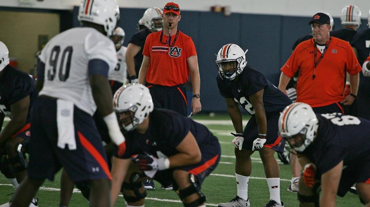 Auburn offensive coordinator Rhett Lashlee watches players practice Thursday, Aug. 4, 2016 at the university's athletic complex.