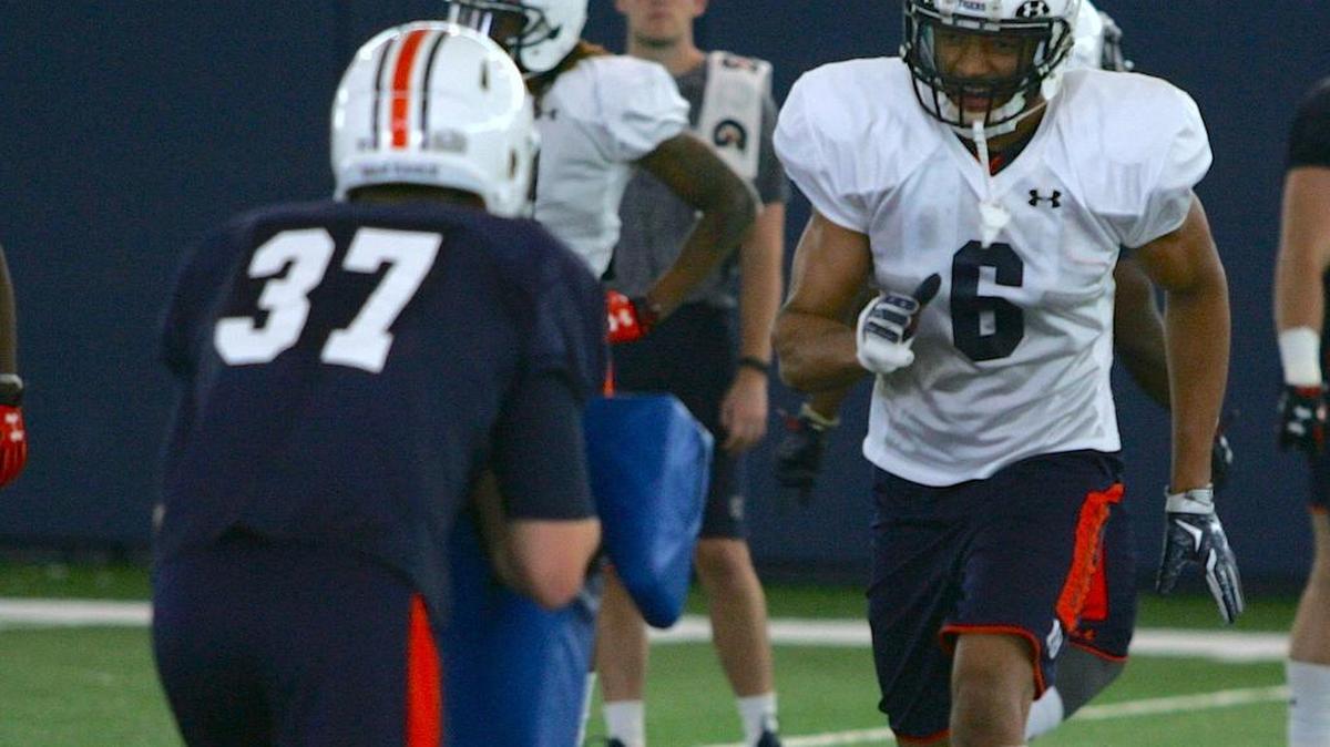 Auburn defensive back Carlton Davis, No. 6, runs drills during spring practice.