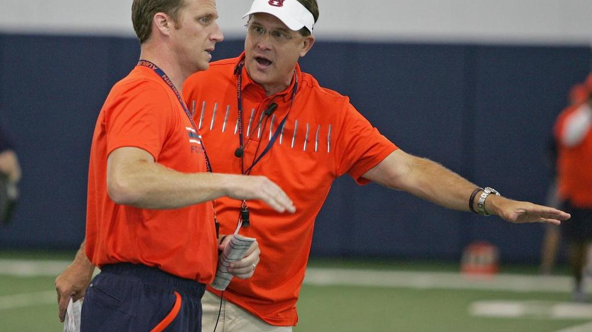 Auburn choach Gus Malzahn talks with Rhett Lashlee on Wednesday, Aug. 3, 2016 at the university's athletic complex.