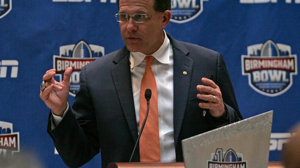 Auburn coach Gus Malzahn, pictured at a Birmingham Bowl press conference, discussed satellite camps again in Atlanta Tuesday night.