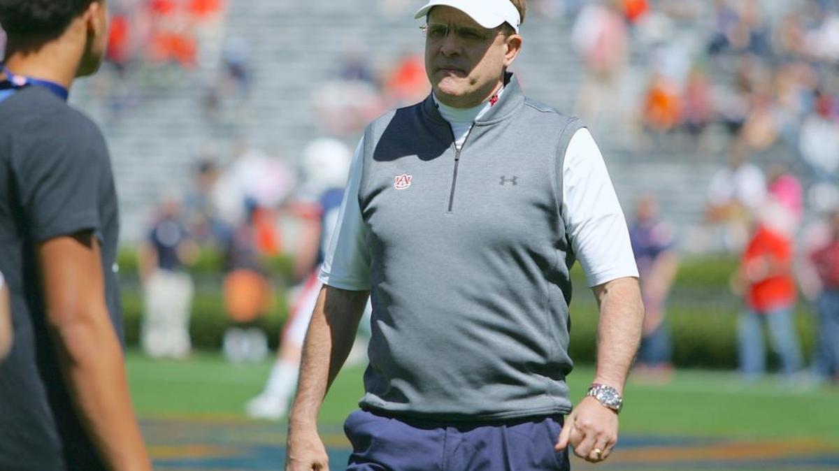 Auburn coach Gus Malzahn walks around the field at Jordan-Hare Stadium before the program's spring game.