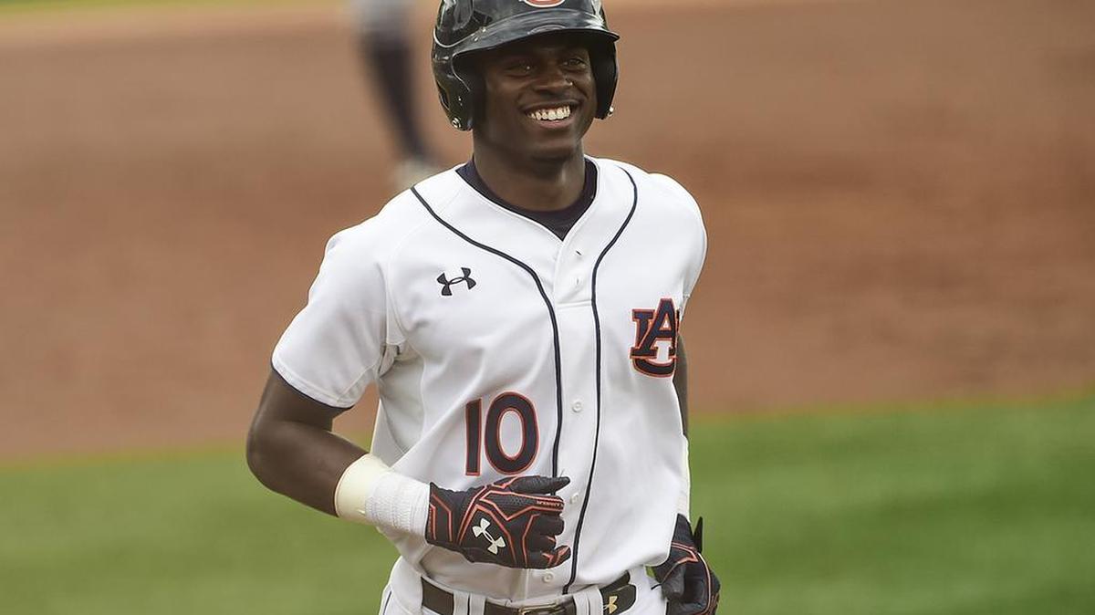 Auburn outfielder Anfernee Grier smiles on the base path against Oral Roberts in March.