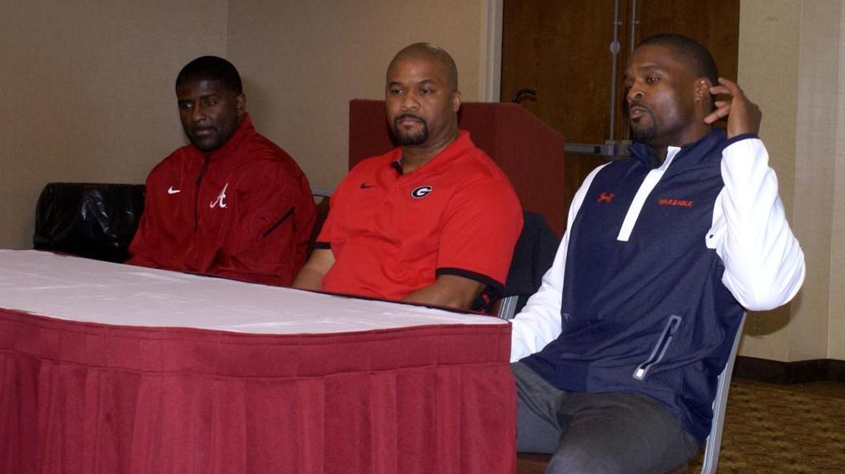 SEC assistant coaches - from left to right - Alabama's Derrick Ansley, Georgia's Dell McGee and Auburn's Travis Williams talking with youth and high school coaches at the Minority Coaches Association of Georgia Football Coaches Conference Thursday night, Feb. 25, 2016.