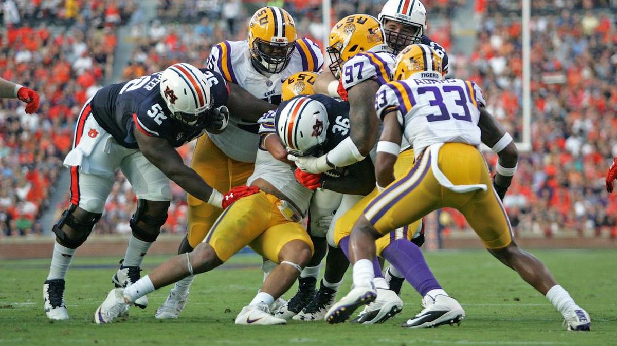 Four LSU defenders try to stop Auburn running back Kamryn Pettway Saturday, Sept. 26, 2016 at Jordan-Hare Stadium.