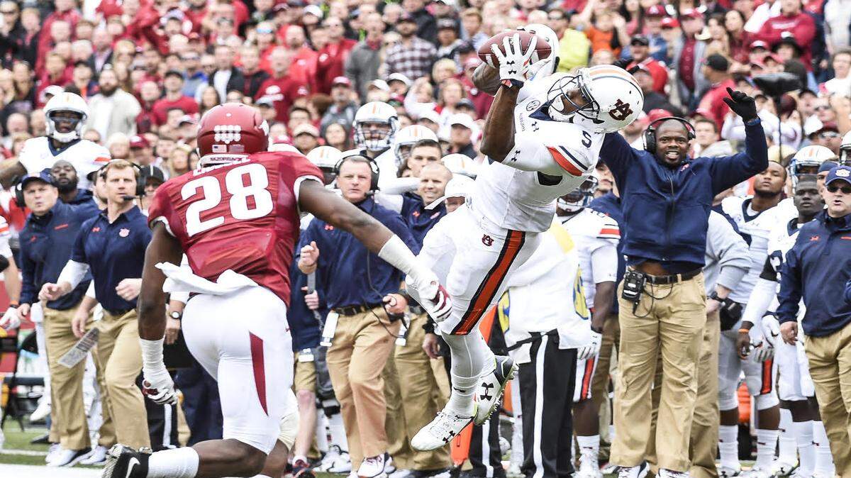 Auburn WR Ricardo Louis, No. 5, catches a pass against Arkansas on Saturday October 24, 2015 in Fayetteville, Ark. Photo by Wade Rackley/Auburn Athletics 
