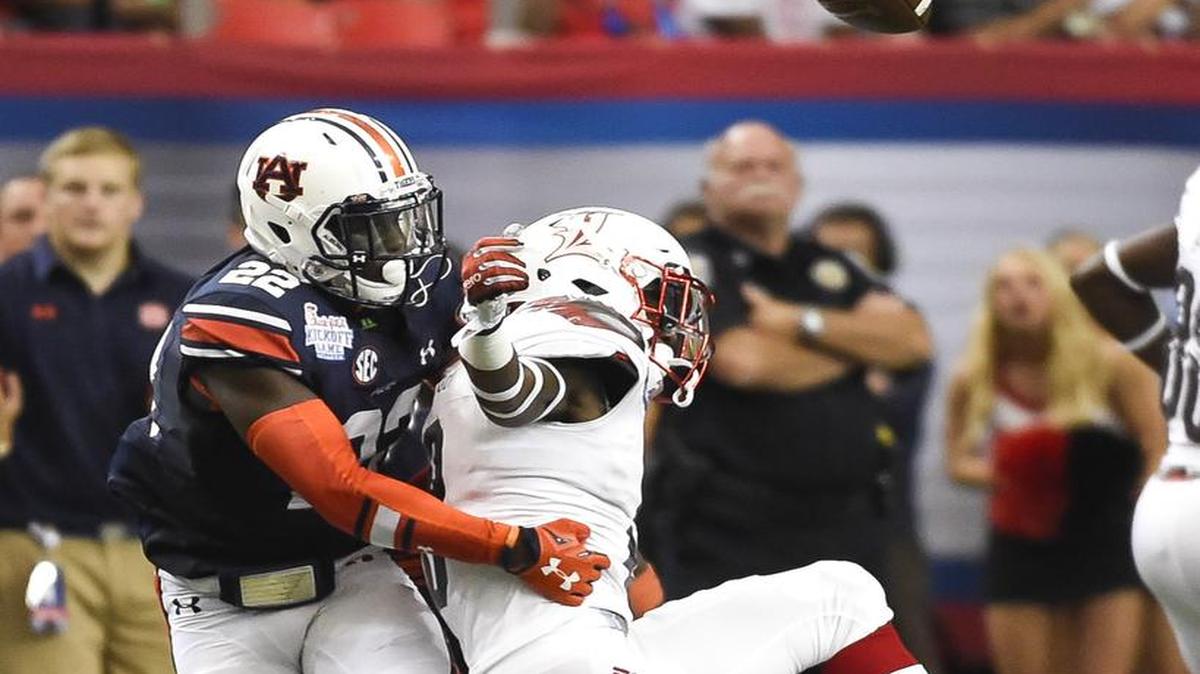 Auburn defensvie back Tim Irvin, No. 22, breaks up a pass.