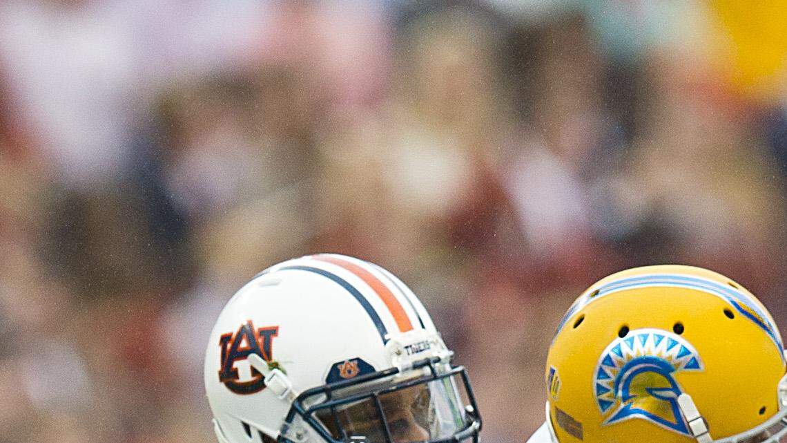 San Jose State running back Tyler Ervin (7) fumbles the ball and is recovered by Auburn defensive back Jonathan Jones (3) during the first half of an NCAA college football game, Saturday, Oct. 3, 2015, in Auburn, Ala. (AP Photo/Brynn Anderson)