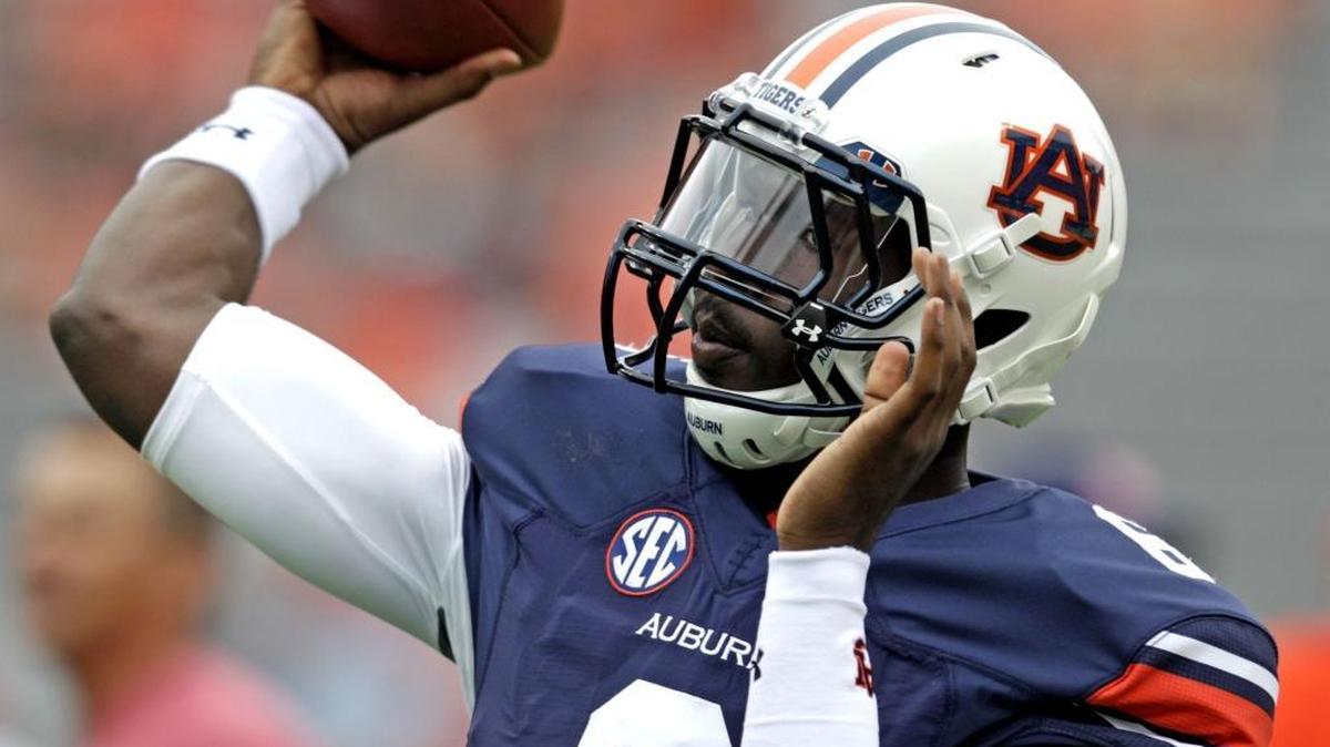 In this file photo from Sept. 12, 2015, Auburn quarterback Jeremy Johnson warms up before the first half of a game against Jacksonville State in Auburn, Ala.