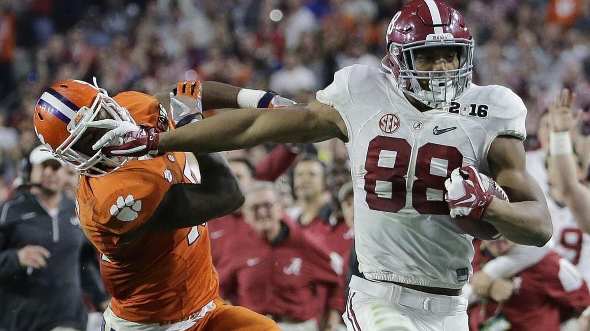Alabama’s O.J. Howard tries to get past Clemson’s T.J. Green after a catch during the second half of the NCAA college football playoff championship game Jan. 11 in Glendale, Ariz. Howard and wide receiver Calvin Ridley were name to the Maxwell Award watch list.