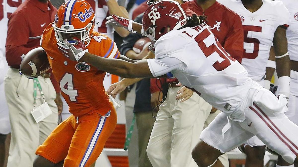 Florida wide receiver Brandon Powell (4) runs against Alabama linebacker Tim Williams (56) during the SEC championship game, Saturday, Dec. 3, 2016, in Atlanta.