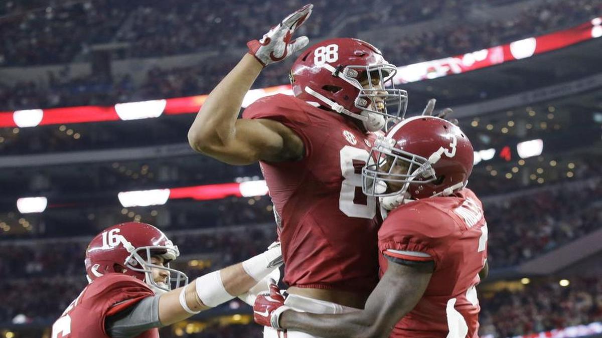 Alabama wide receiver Calvin Ridley, right, celebrates his touchdown against Michigan State with tight end O.J. Howard, center, as wide receiver Richard Mullaney joins in during the second half of the Cotton Bowl college football semifinal playoff game on Dec. 31, 2015, in Arlington, Texas.